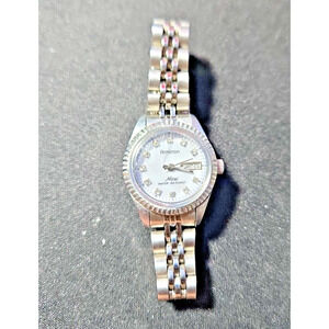 LADIES' ARMITRON NOW DAY/DATE MARKER WATCH - FLUTED BEZEL JUBILEE BAND - BBA-22